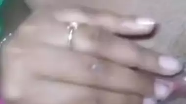 Desi bitch pulls pink dress up to XXX finger her wet hairy pussy