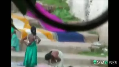 Local guy caught sexy Indian aunts take a bath outdoor in the river. era desi