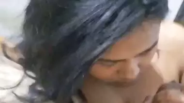 GF with smiling face gives blowjob to boyfriend