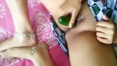 Horny Desi gal brave enough to shove cucumber into bald XXX snatch