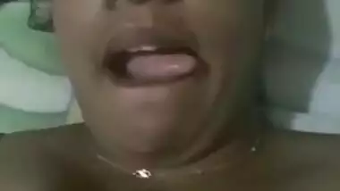 Indian aunty with sexy full lips takes big natural boobs out in bed