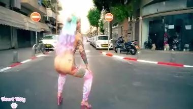 Colorful kawaii girl twerking in empty street during quarantine (no nudity)
