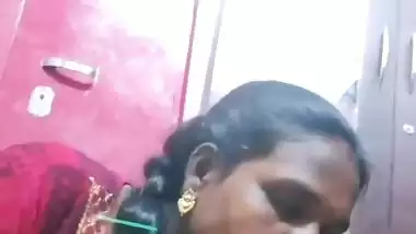 Mature tattooed Tamil wife giving handjob to husband