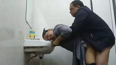 Wife in abroad fucked by office manager in washroom