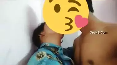 Desi girl in floral shirt kisses porn partner being covered with a smile