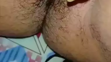 Bhabhi in glasses goes naked and fingers cunt