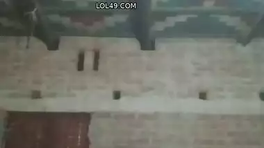 Village girl applying lotion to full nude body