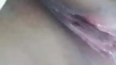 Risque Indian babe takes breasts and pussy out in a short porn video