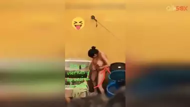 Horny Desi aunty fingering hairy pussy while bathing in a outdoor