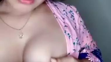 Horny Desi whore reveals and licks her young boobs on XXX camera